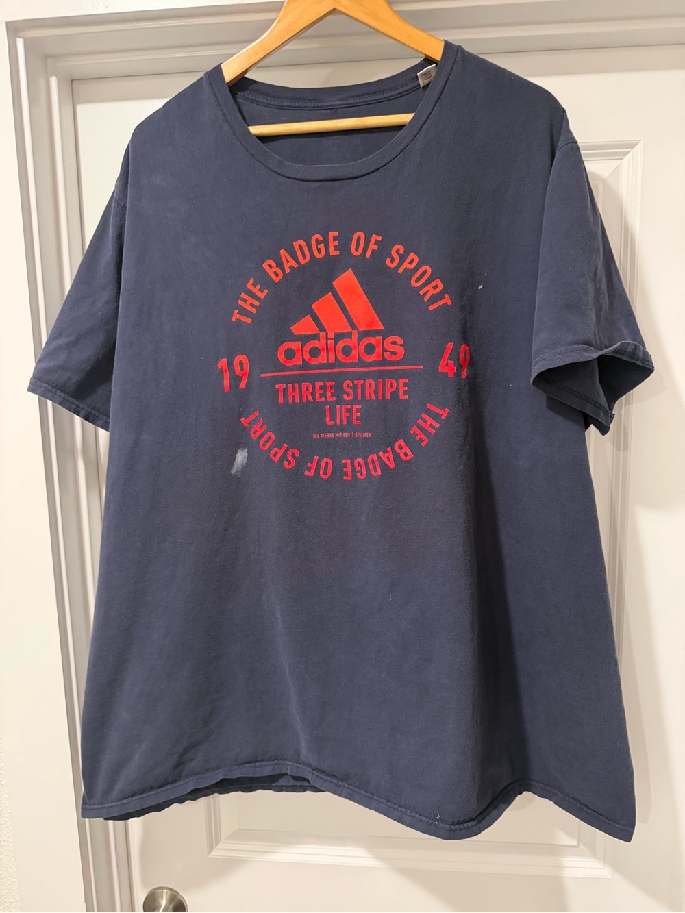 adidas Navy Blue Short Sleeve Tee with Red Logo Graphic